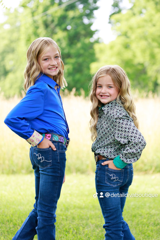 Two girls in show shirts and jeans.