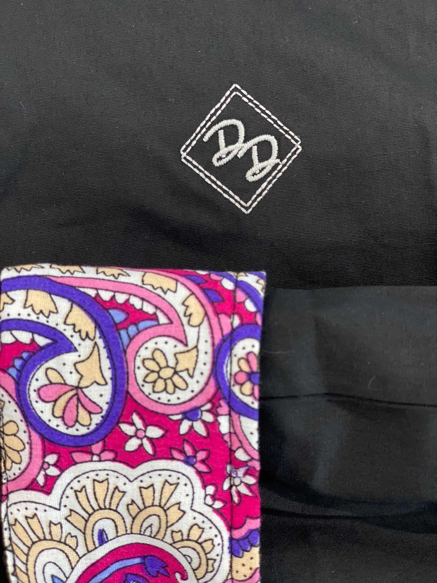 Youth show shirt. Lightweight, breathable fabric with a solid black color. Shirt offers a multi-colored paisley print cuff and placket. Made of 100% cotton.